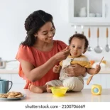 baby-weaning-caring-black-mother-260nw-2100706669
